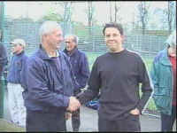 New signing Ian Booth shakes the hand of Roger Teague before playing is first game for the fielders.